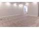 Bright, open bedroom with neutral carpet and an ensuite bathroom at 13125 Casabella Dr, Windermere, FL 34786