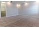 Bedroom featuring neutral carpet, white walls, baseboards, walk-in closet with custom shelving at 13125 Casabella Dr, Windermere, FL 34786