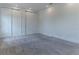 Bedroom featuring neutral carpet, white walls, baseboards, and closet with sliding doors at 13125 Casabella Dr, Windermere, FL 34786