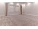 Spacious bedroom featuring neutral carpet, recessed lighting, and large windows with stylish curtains at 13125 Casabella Dr, Windermere, FL 34786