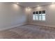 Neutral bedroom featuring modern plantation shutters and neutral carpet at 13125 Casabella Dr, Windermere, FL 34786