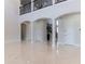 Spacious foyer featuring high ceilings, arched entryways, and staircase that offers an open and airy feel at 13125 Casabella Dr, Windermere, FL 34786