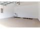Spacious two car garage features bright epoxy flooring and a utility sink for added convenience at 13125 Casabella Dr, Windermere, FL 34786
