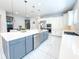 Modern kitchen with a large island, stainless steel appliances, and stylish pendant lighting, perfect for entertaining at 13125 Casabella Dr, Windermere, FL 34786