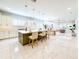 Spacious open-concept kitchen with large island, pendant lighting, and adjacent dining and living area at 13125 Casabella Dr, Windermere, FL 34786