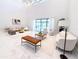 Expansive living room with high ceilings, marble floors, and stylish furnishings creating an inviting atmosphere at 13125 Casabella Dr, Windermere, FL 34786