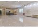 Open-concept living space with modern kitchen, sleek flooring, and decorative wall panel creating a stylish ambiance at 13125 Casabella Dr, Windermere, FL 34786