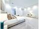 Bright bedroom boasts neutral tones, plush carpeting, and an ensuite bathroom at 13125 Casabella Dr, Windermere, FL 34786