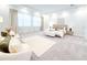 Spacious main bedroom suite with plush carpeting, a seating area, and luxurious finishes at 13125 Casabella Dr, Windermere, FL 34786