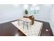 Bright office space with modern desk and decor, complemented by a soft patterned rug and dark hardwood floors at 13125 Casabella Dr, Windermere, FL 34786