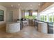 Outdoor kitchen with tiled countertop and a stainless-steel grill with hood at 13125 Casabella Dr, Windermere, FL 34786