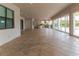 Large tiled patio features great indoor/outdoor living and views of the outdoor kitchen and entertainment area at 13125 Casabella Dr, Windermere, FL 34786