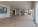 Large tiled patio features great indoor/outdoor living and views of the outdoor kitchen and entertainment area at 13125 Casabella Dr, Windermere, FL 34786