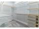 Spacious walk-in closet with custom shelving, rods, and storage bins for organization at 13125 Casabella Dr, Windermere, FL 34786