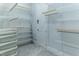 Expansive walk-in closet with built-in shelving and ample storage space at 13125 Casabella Dr, Windermere, FL 34786