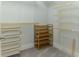 Walk-in closet with adjustable shelving provides versatile storage options at 13125 Casabella Dr, Windermere, FL 34786