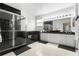 Sleek bathroom with black marble accents, a glass shower, and ample counter space for a luxurious feel at 13640 Dornoch Dr, Orlando, FL 32828