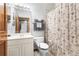 Accessible bathroom equipped with grab bars, modern fixtures, and a neutral color scheme for a safe and stylish experience at 13640 Dornoch Dr, Orlando, FL 32828