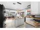 Well-lit kitchen with an island, granite countertops, and seamless access to the open-concept living areas at 13640 Dornoch Dr, Orlando, FL 32828