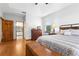 Spacious main bedroom with natural light, hardwood floors, and an ensuite bathroom for added convenience at 13640 Dornoch Dr, Orlando, FL 32828
