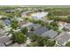 Beautiful aerial view of homes with a lovely pond in a desirable community at 14131 Paradise Tree Dr, Orlando, FL 32828