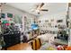 Fun bedroom with a bright TV, colorful wall decor, and a comfortable bed for relaxing or entertaining friends at 14131 Paradise Tree Dr, Orlando, FL 32828