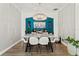 Stylish dining room with contemporary lighting, a large dining table, and a built-in bar, perfect for entertaining at 14131 Paradise Tree Dr, Orlando, FL 32828