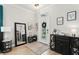 Bright entryway with hardwood floors, decorative mirror, and stylish console table creating a welcoming ambiance at 14131 Paradise Tree Dr, Orlando, FL 32828