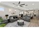 Open living area with modern ceiling fan and decor adjacent to a stylish, open kitchen at 14131 Paradise Tree Dr, Orlando, FL 32828