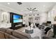 Cozy living room featuring a fireplace, ceiling fan, and sliding glass doors to the backyard at 14131 Paradise Tree Dr, Orlando, FL 32828
