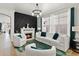 Cozy living room features a modern fireplace, plush seating, and ample natural light for a comfortable space at 14131 Paradise Tree Dr, Orlando, FL 32828