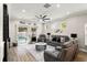Comfortable living room with sliding glass doors opening to a pool area at 14131 Paradise Tree Dr, Orlando, FL 32828