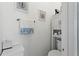 Charming powder room with fresh white walls, decorative accents, and a convenient storage cabinet at 14131 Paradise Tree Dr, Orlando, FL 32828