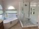 Bathroom showcasing soaking tub and glass enclosed shower with seating at 1474 Thornhill Cir, Oviedo, FL 32765