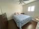 Relaxing bedroom with a floral patterned bed and shuttered window at 1474 Thornhill Cir, Oviedo, FL 32765