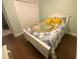 Bedroom featuring bed with yellow pillows and a large ornate mirror at 1474 Thornhill Cir, Oviedo, FL 32765