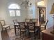 Bright dining room featuring plantation shutters and a classic dining set at 1474 Thornhill Cir, Oviedo, FL 32765