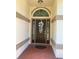 The front door features decorative glass and a transom window at 1474 Thornhill Cir, Oviedo, FL 32765