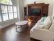 Inviting living room showcasing natural light and a stylish media center at 1474 Thornhill Cir, Oviedo, FL 32765