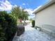 Beautiful backyard with brick patio, bench seating, grill, and lush landscaping at 15157 Pigeon Plum Ln, Winter Garden, FL 34787
