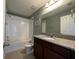 Bathroom with shower over bath and granite topped vanity at 15157 Pigeon Plum Ln, Winter Garden, FL 34787