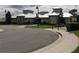 Community clubhouse exterior with attractive landscaping and ample parking space at 15157 Pigeon Plum Ln, Winter Garden, FL 34787