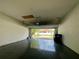Spacious garage with an open door, providing ample parking and storage at 15157 Pigeon Plum Ln, Winter Garden, FL 34787