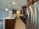 Beautiful kitchen featuring stainless steel appliances, granite countertops, and a kitchen island at 15157 Pigeon Plum Ln, Winter Garden, FL 34787