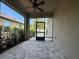 Screened-in patio with brick flooring and a ceiling fan offers a comfortable outdoor space at 15157 Pigeon Plum Ln, Winter Garden, FL 34787