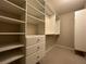 Well-organized walk-in closet with custom shelving and drawers at 15157 Pigeon Plum Ln, Winter Garden, FL 34787