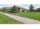 Well-maintained home showcasing lush green grass and an elegant fence, creating a serene outdoor space at 16892 Hypatia Aly, Winter Garden, FL 34787