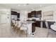 Spacious kitchen with stainless steel appliances, granite countertops, and a large center island with bar seating at 16892 Hypatia Aly, Winter Garden, FL 34787