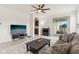 Bright living room with stylish decor, a comfortable sofa, and sliding glass doors leading to an outdoor space at 16892 Hypatia Aly, Winter Garden, FL 34787