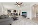 Open-concept living space with a comfortable seating area and a view of the dining area and kitchen, promoting connectivity at 16892 Hypatia Aly, Winter Garden, FL 34787